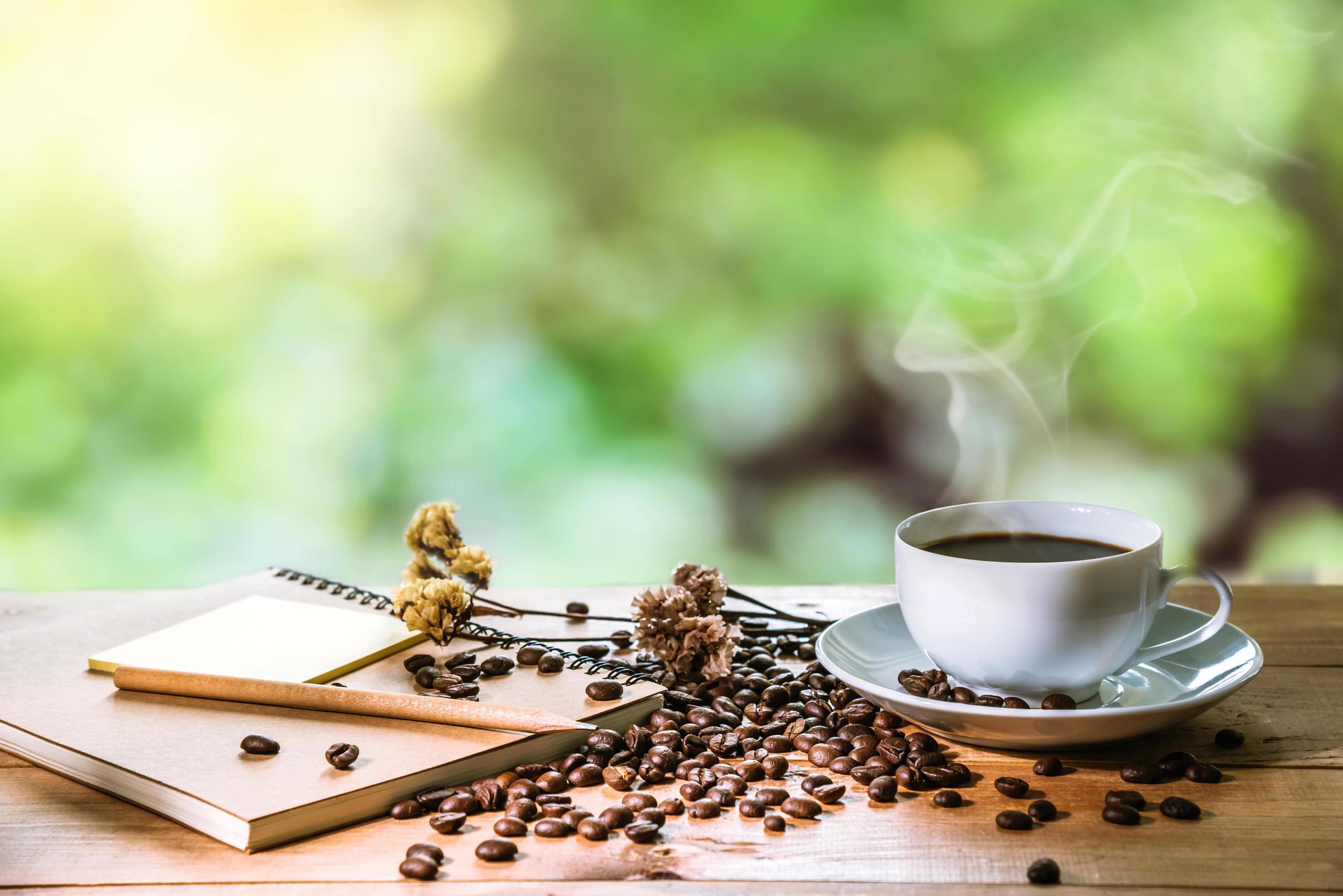 morning-cup-of-coffee-espresso-and-coffee-beans-the-background-nature-blur-free-photo.jpg